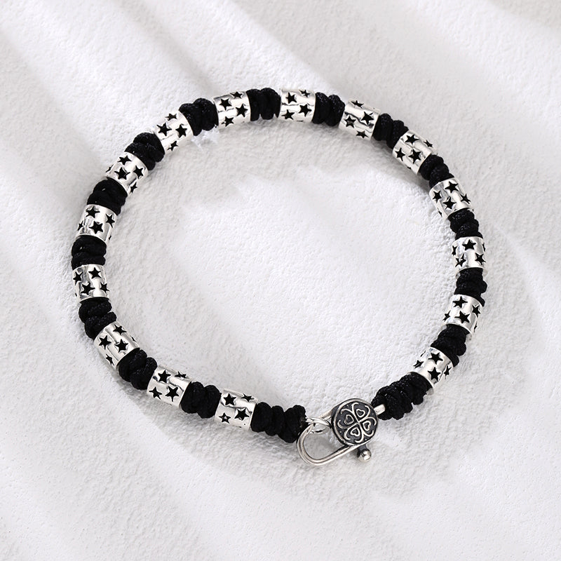 [full] - Sterling silver star bead bracelet with black cord and polished finish.